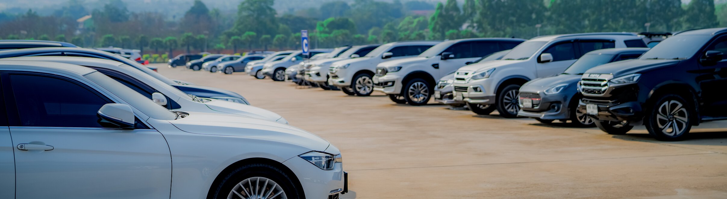 Car parked at outdoor parking lot. Used car for sale and rental